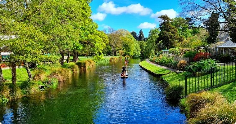 Punting down the river avon on a clear summers day in Christchurch New Zealand